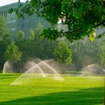 Professional irrigation system watering lush green lawn in a private commercial setting